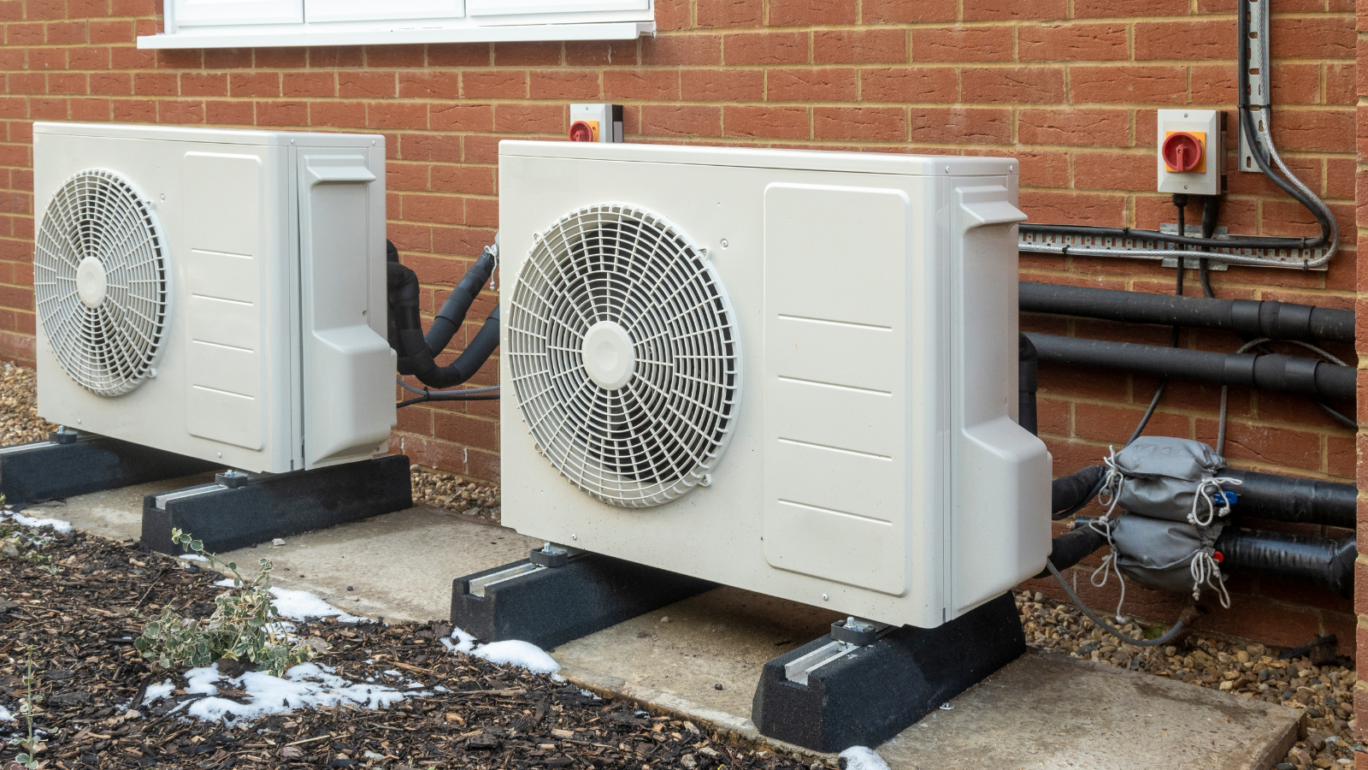 Two heat pump units outside a building